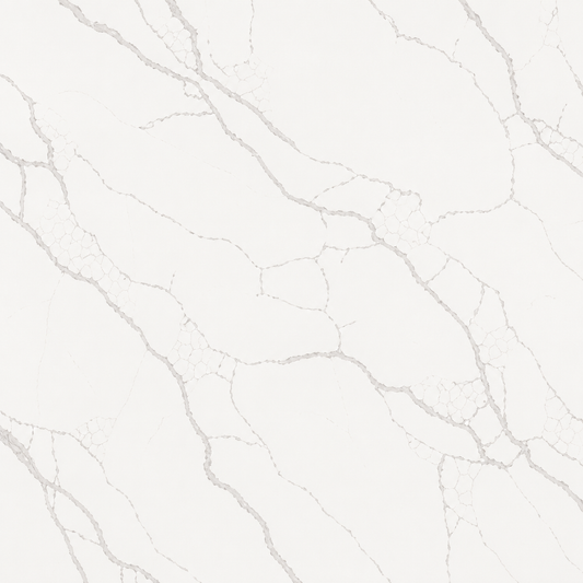 A close-up of a light warm white marble or quartz surface with soft gray veining running diagonally across the frame | USA Cabinets Outlet 