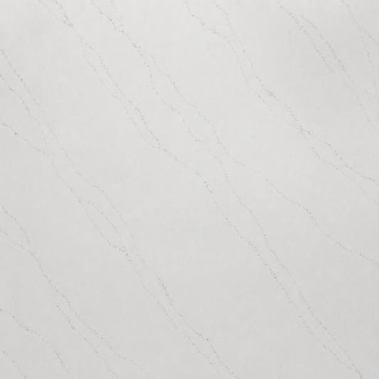 A close-up of a light gray to off-white surface with subtle diagonal veining, resembling polished stone or a material swatch.| USA Cabinets Outlet