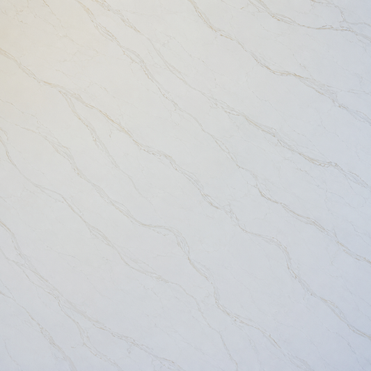 A close-up of a light warm off-white or cream surface with soft beige veining, resembling marble or a stone tile texture.| USA Cabinets Outlet 