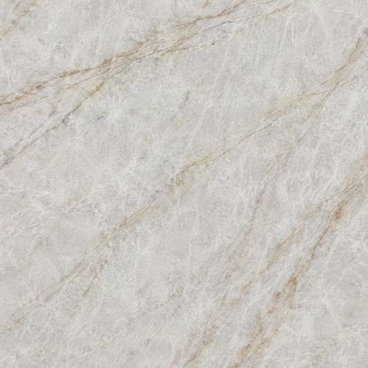 A close-up of a light beige marble or quartzite surface with soft gray veining and warm tan streaks running diagonally across the texture | USA Cabinets Outlet 