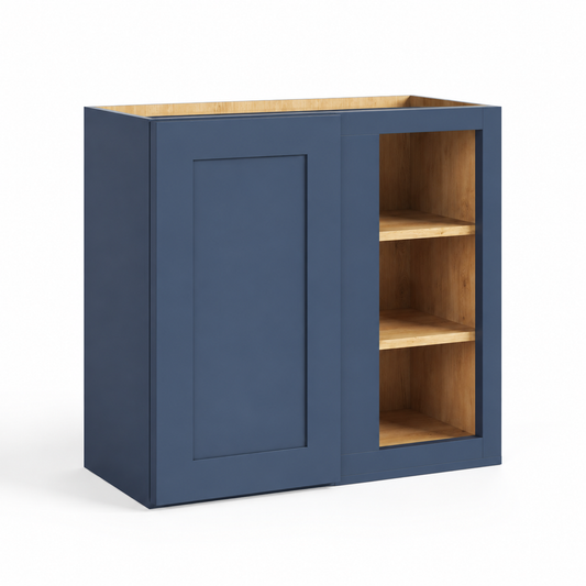 A navy blue wall cabinet with one paneled door and one open shelving section, showing natural wood interior shelves and top, on a white background.| USA Cabinet Outlet |