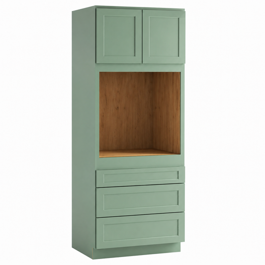 A tall, narrow storage cabinet in a muted sage green finish, featuring two upper doors, a central open shelf with a wood-look interior, and three lower drawers with decorative panel detailing.|USA Cabinets Outlet|