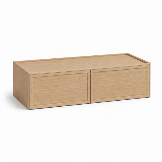A light oak wood two-drawer storage bench or low cabinet, shown from a three-quarter angle on a clean white background at USA Cabinets Outlet