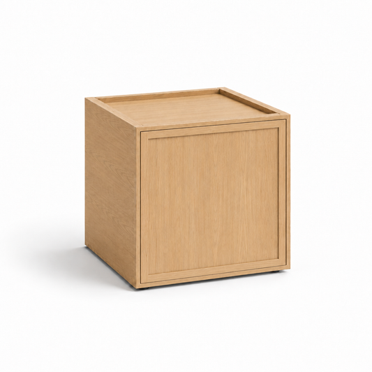 A light oak wood cube side table or storage cabinet with a recessed front panel, shown on a clean white background at USA Cabinets Outlet