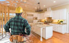 Person in a hard hat walking through a kitchen under construction ( USA Cabinets Outlet )